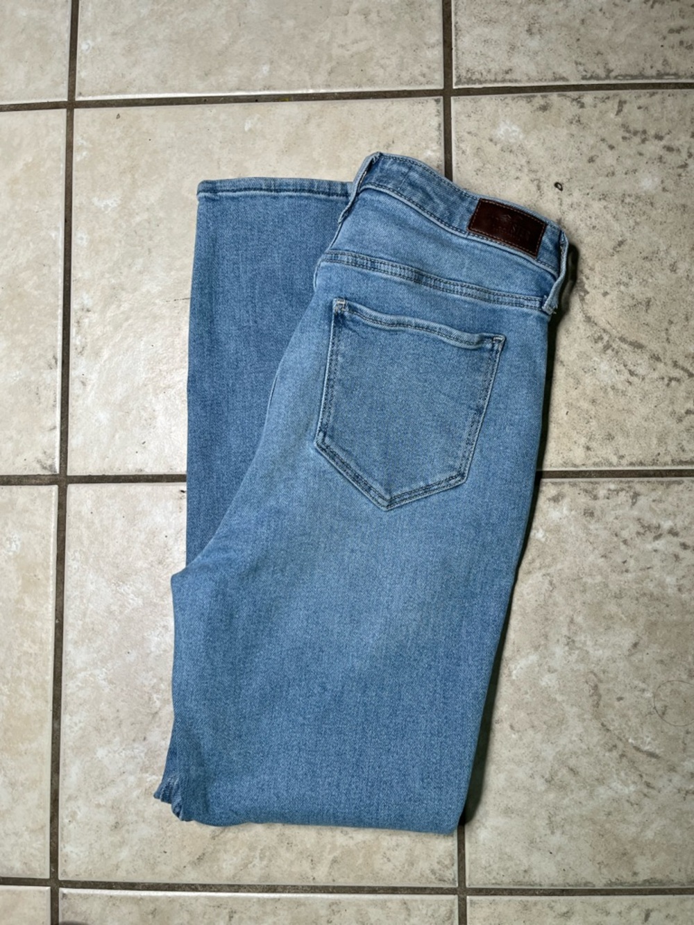 Hollister Light Blue Denim Jeans with Brown Leather Patch